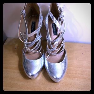 Women size 10 metallic silver heels.